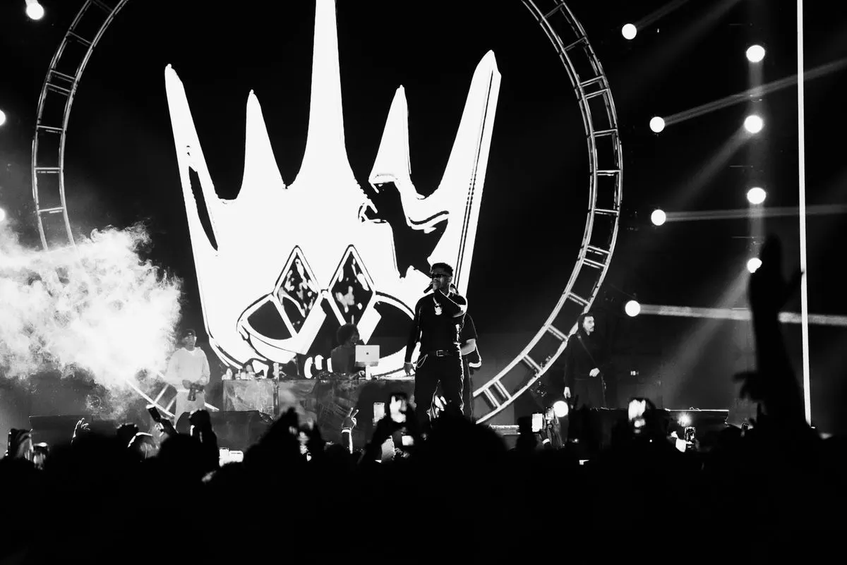 A performer on stage in front of a crowd